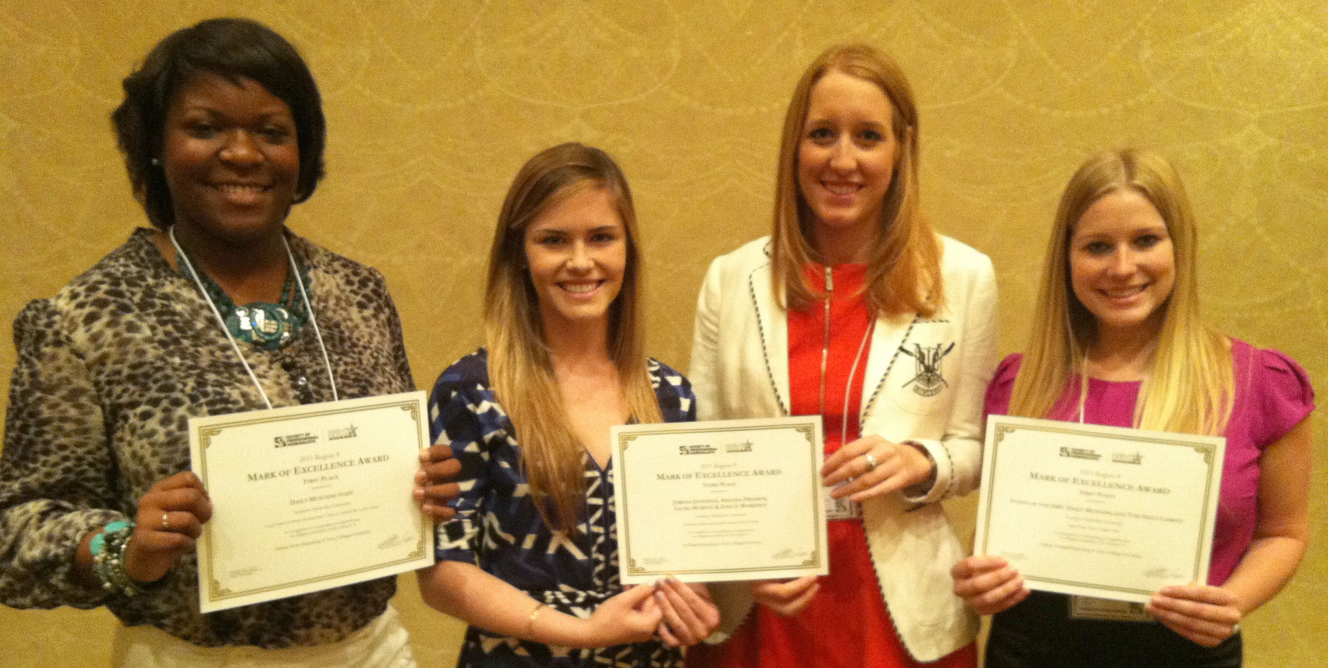 E'Lyn Taylor (left) accepts the Daily Mustang's 1st place award for Online News Reporting ("Locals Gather at Former President Bush's Home to Celebrate Bin Laden's Death"); Laura Murphy and Jordan Jennings (center) accept 3rd place for In-Depth Reporting ("Discrepancy Between Levels of Public Education Visible in Dallas," with Amanda Presmyk and Essete Workneh); and Natalie Posgate (right) accepts the joint staff award for the Daily Mustang and Daily Campus, 1st place, Online In-Depth Reporting, for the Light of Day Project: Campus Crime.